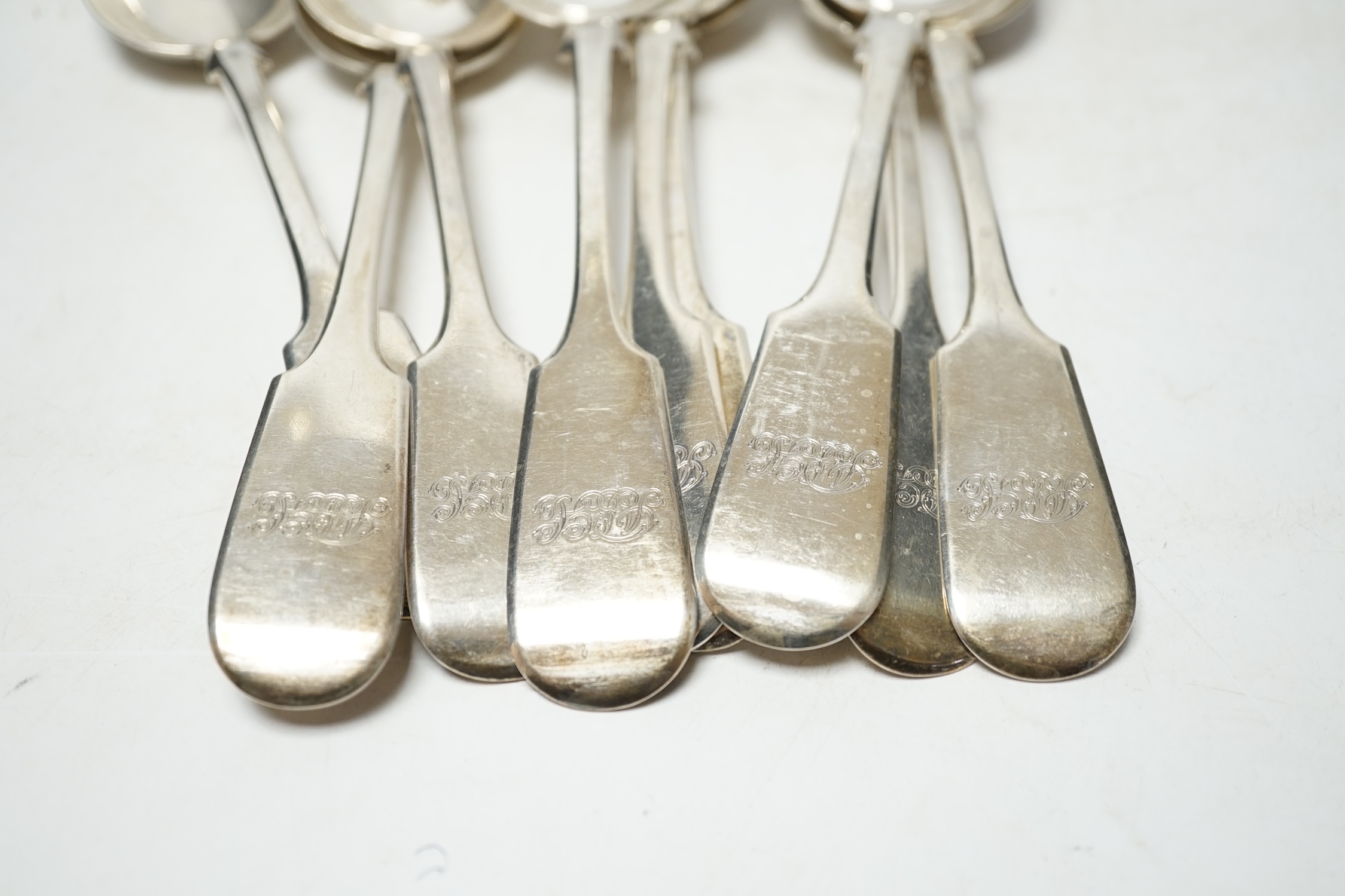 A set of twelve Victorian provincial silver fiddle pattern tablespoons, by Robert Williams & Sons, Exeter, 1852, 22.8cm, 30.4oz. Condition - fair